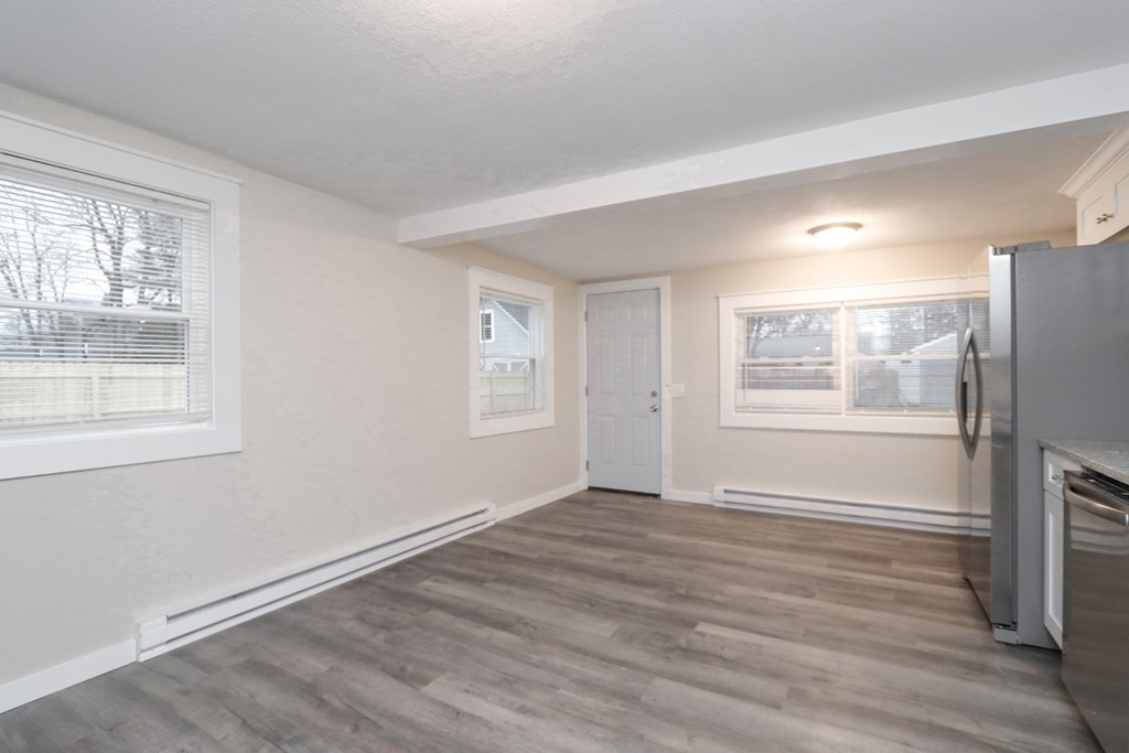 40 Vincent Street Springfield, MA 01129 - Photo 13 of 35 a view of an empty room with wooden floor and a window