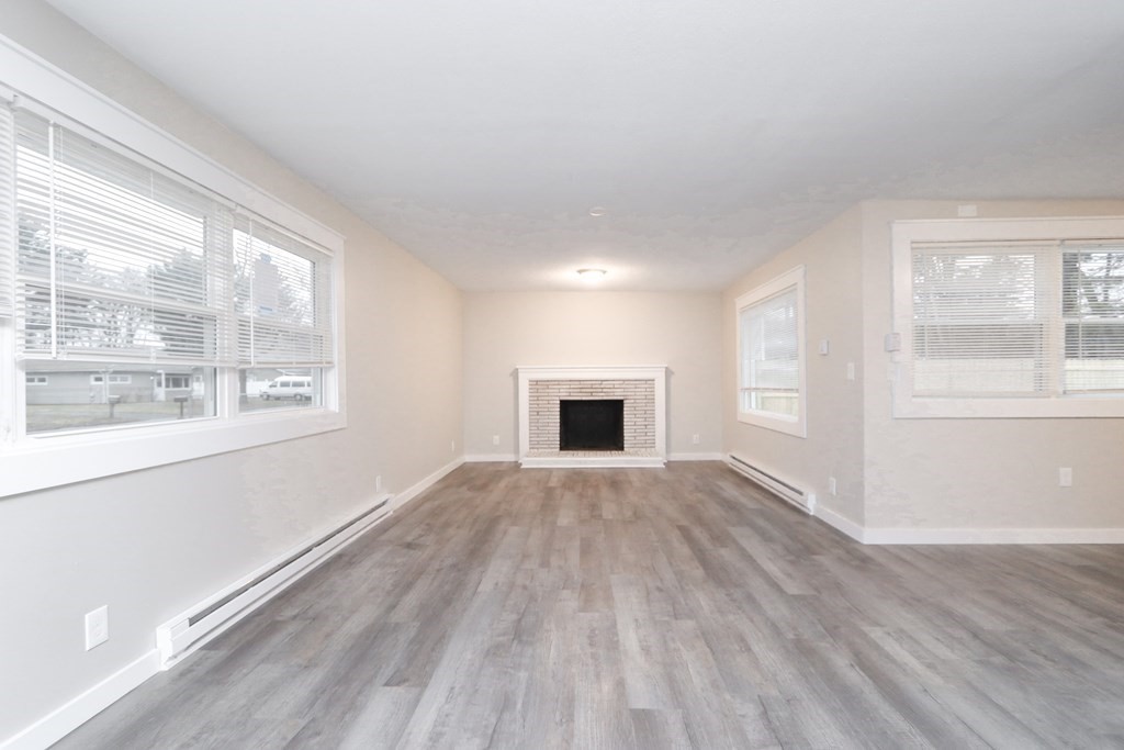40 Vincent Street Springfield, MA 01129 - Photo 3 of 35 a view of an empty room with wooden floor and a window