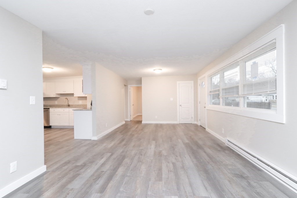 40 Vincent Street Springfield, MA 01129 - Photo 8 of 35 a view of a kitchen with wooden floor and a kitchen