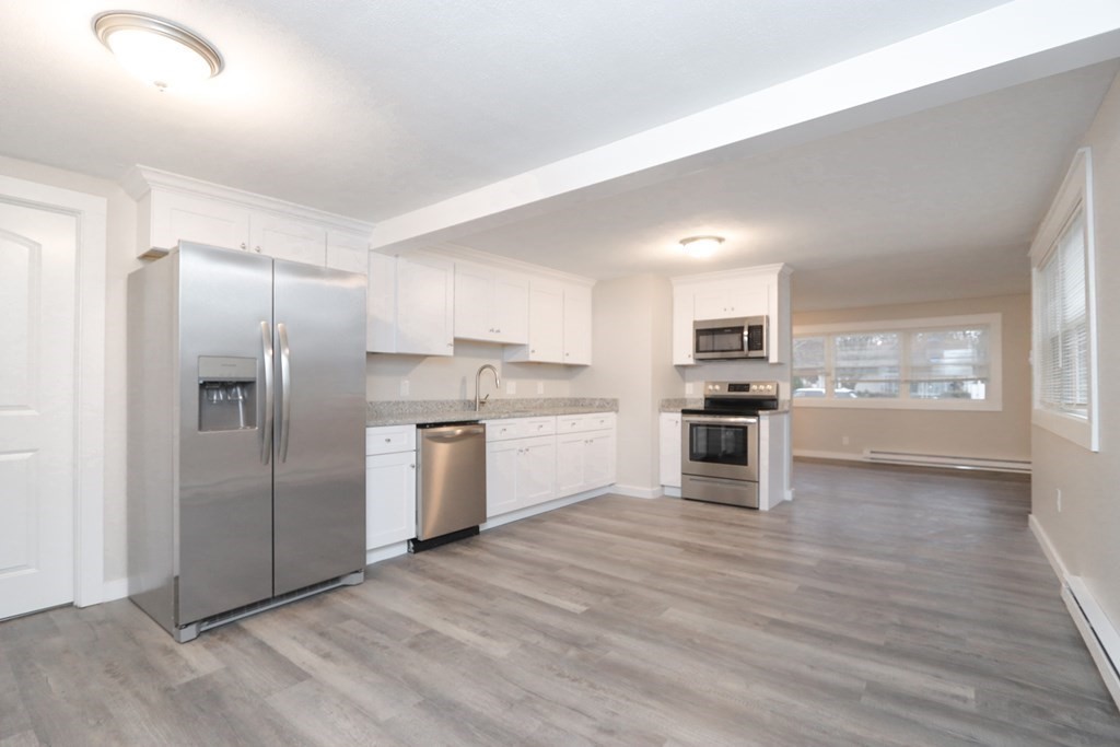 40 Vincent Street Springfield, MA 01129 - Photo 9 of 35 a kitchen with a refrigerator and a oven