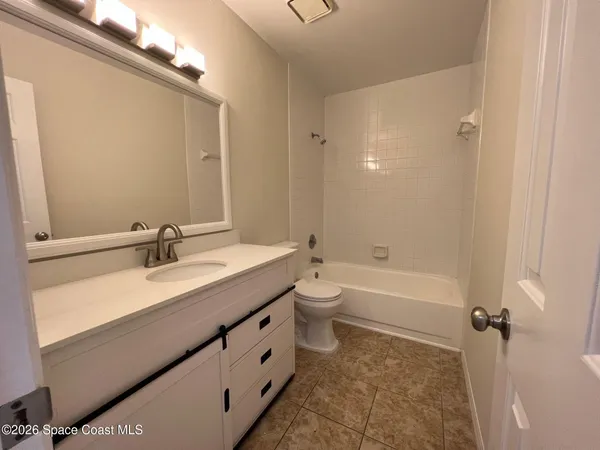 a bathroom with a sink a toilet and a bathtub