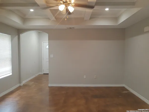 an empty room with a empty space and a window