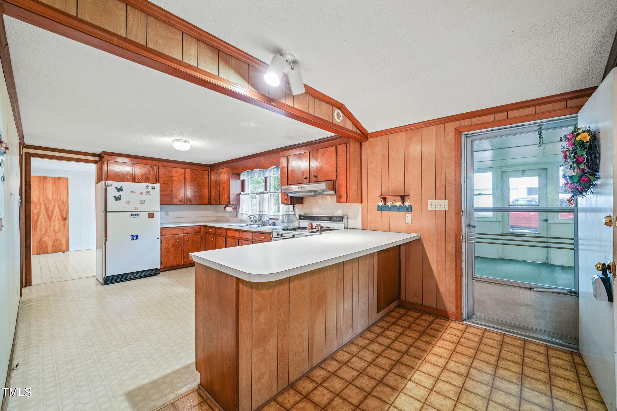 3015 Old Raleigh Road Apex, NC 27502 - Photo 14 of 47 a kitchen with stainless steel appliances granite countertop a sink and cabinets