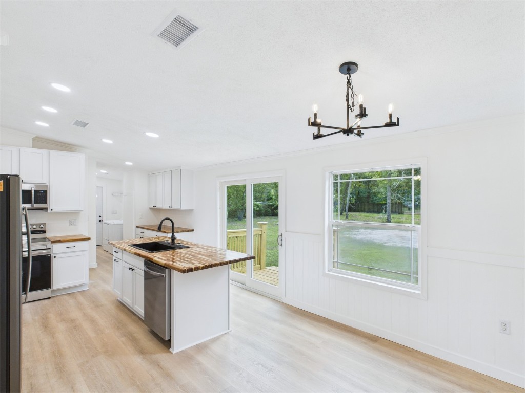 85490 Alene Road Yulee, FL 32097 - Photo 11 of 49 a kitchen with a sink stainless steel appliances and cabinets
