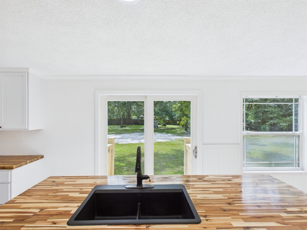 85490 Alene Road Yulee, FL 32097 - Photo 16 of 49 a view of a bedroom with a window and wooden floor