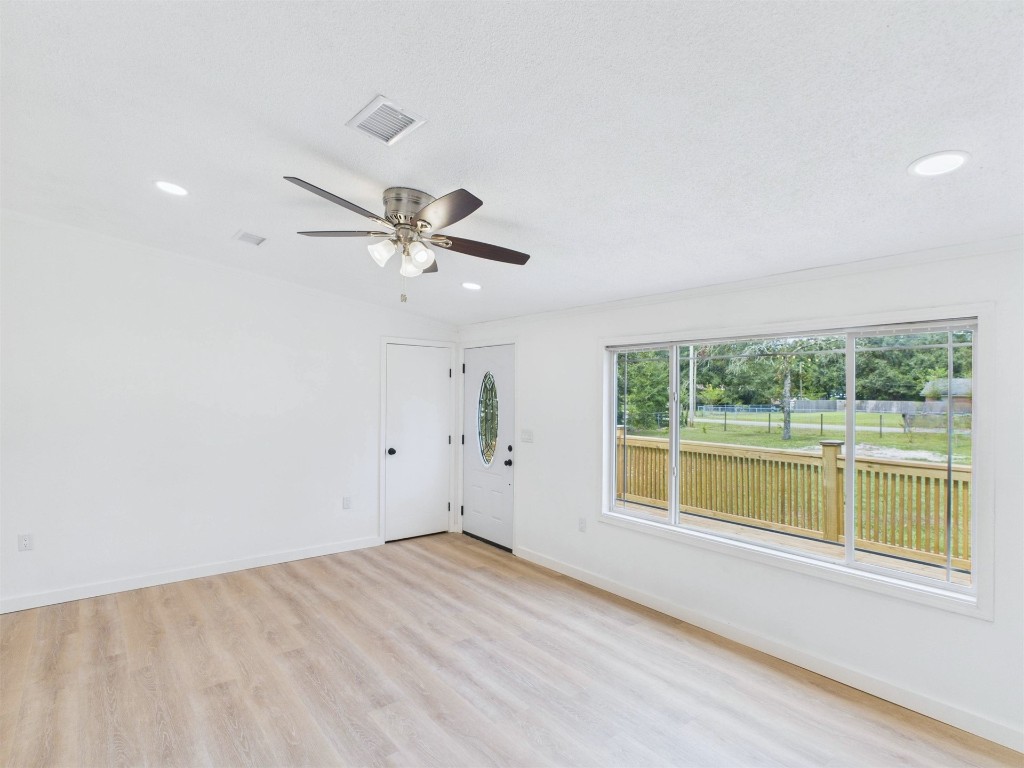 85490 Alene Road Yulee, FL 32097 - Photo 20 of 49 an empty room with a window and ceiling fan