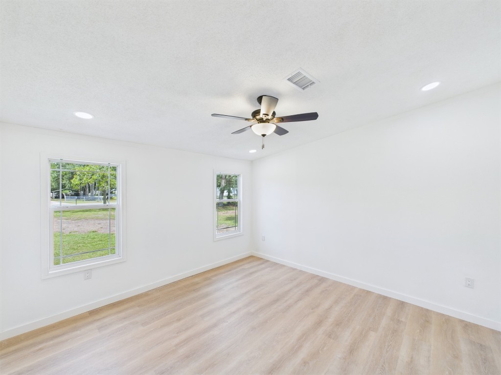 85490 Alene Road Yulee, FL 32097 - Photo 21 of 49 an empty room with a window and a fan