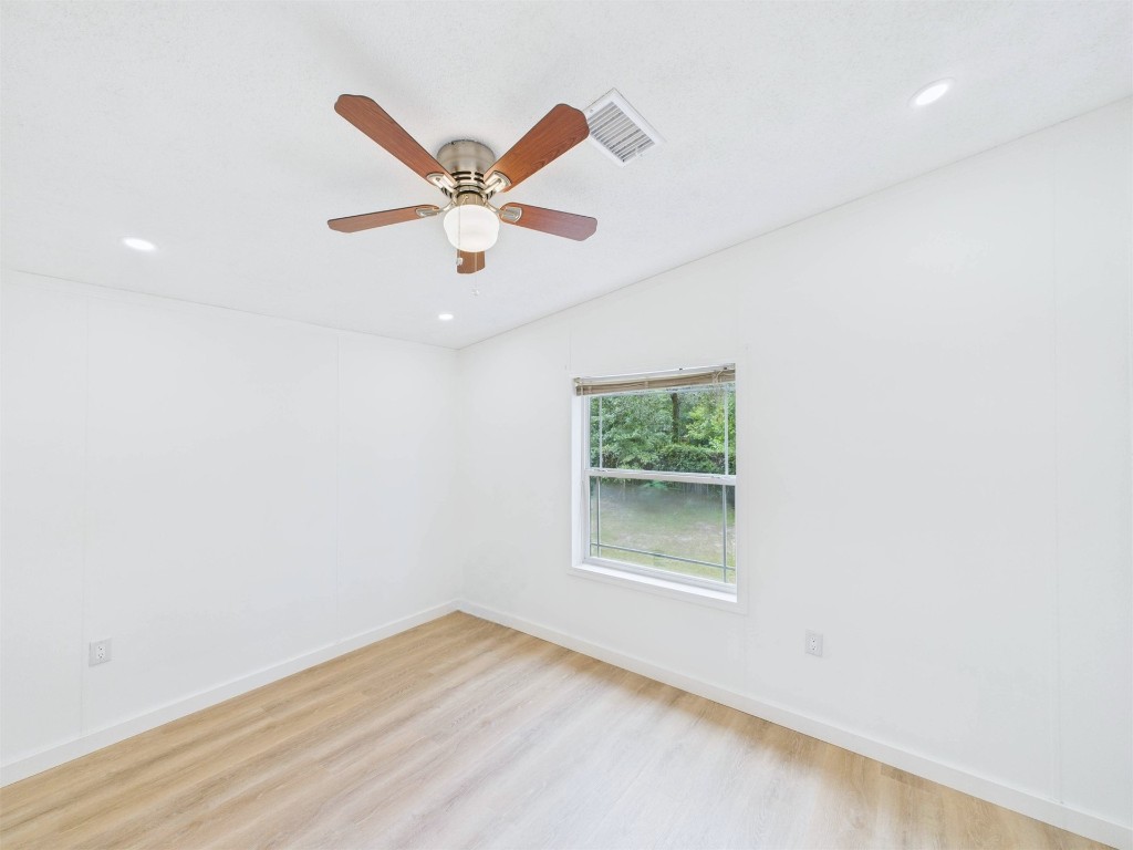 85490 Alene Road Yulee, FL 32097 - Photo 29 of 49 an empty room with a window and a ceiling fan