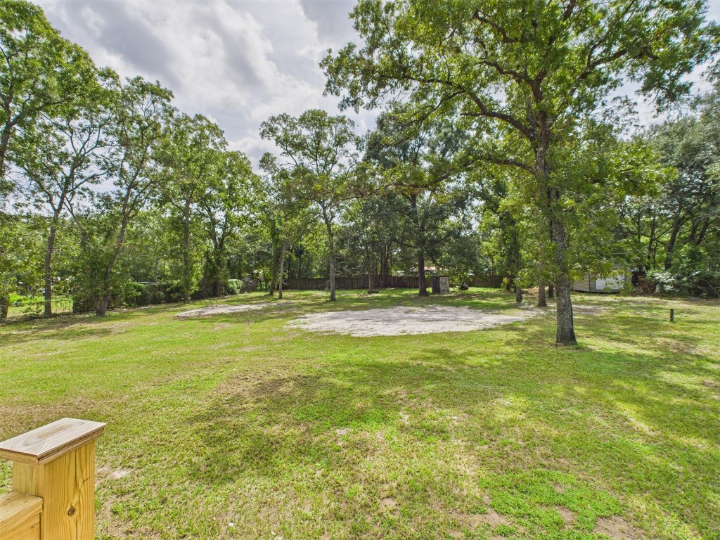 85490 Alene Road Yulee, FL 32097 - Photo 31 of 49 a view of yard with swimming pool and trees