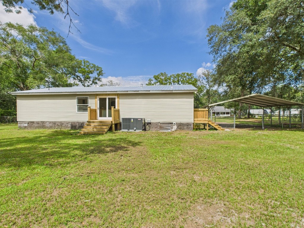 85490 Alene Road Yulee, FL 32097 - Photo 33 of 49 a view of a house with backyard and sitting area