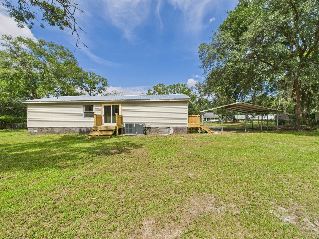 85490 Alene Road Yulee, FL 32097 - Photo 34 of 49 a front view of house with yard and trees