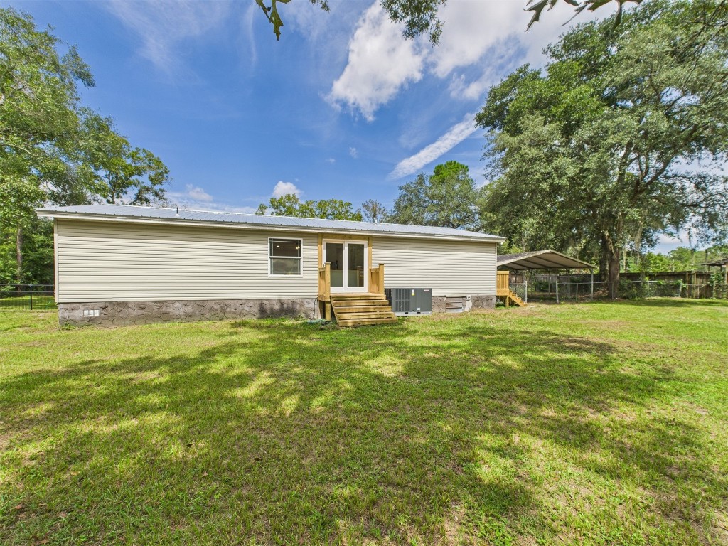 85490 Alene Road Yulee, FL 32097 - Photo 35 of 49 a view of a house with a backyard