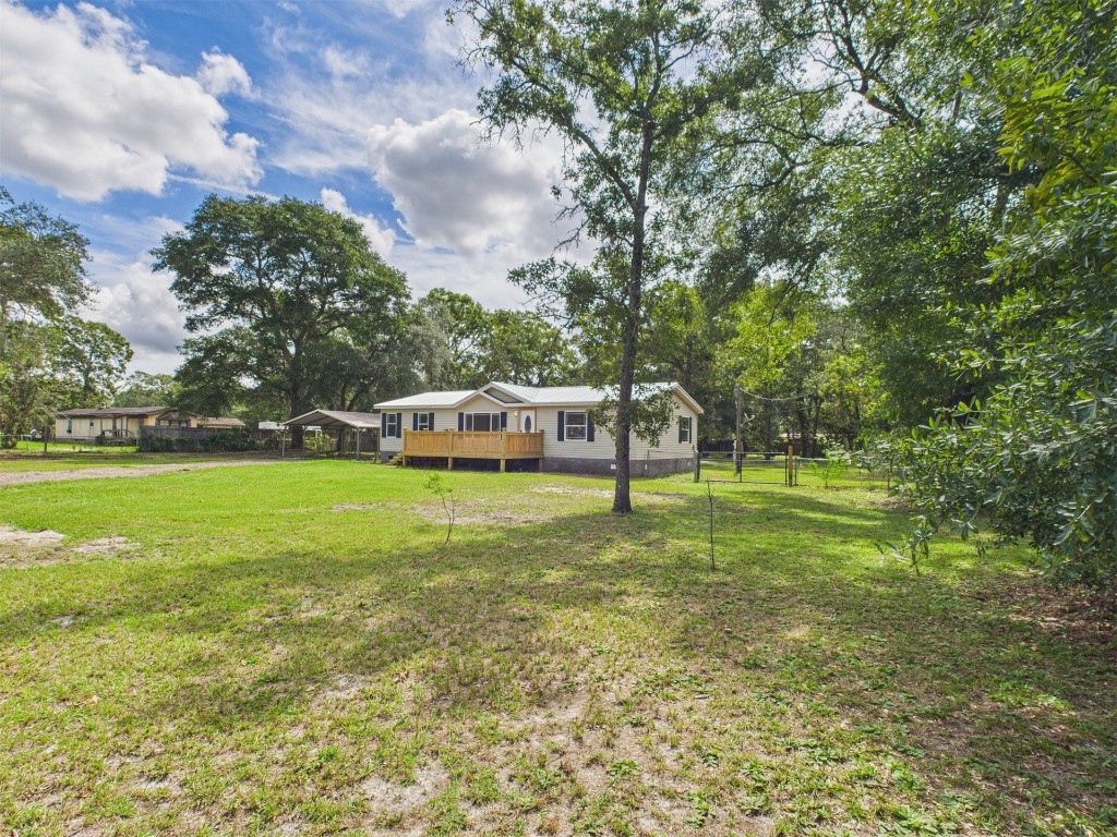 85490 Alene Road Yulee, FL 32097 - Photo 4 of 49 a house view with swimming pool in front of it