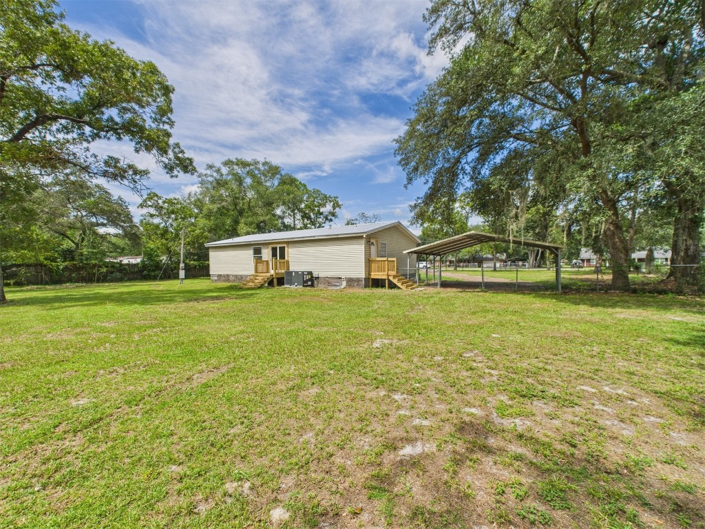 85490 Alene Road Yulee, FL 32097 - Photo 44 of 49 a view of a house with a yard
