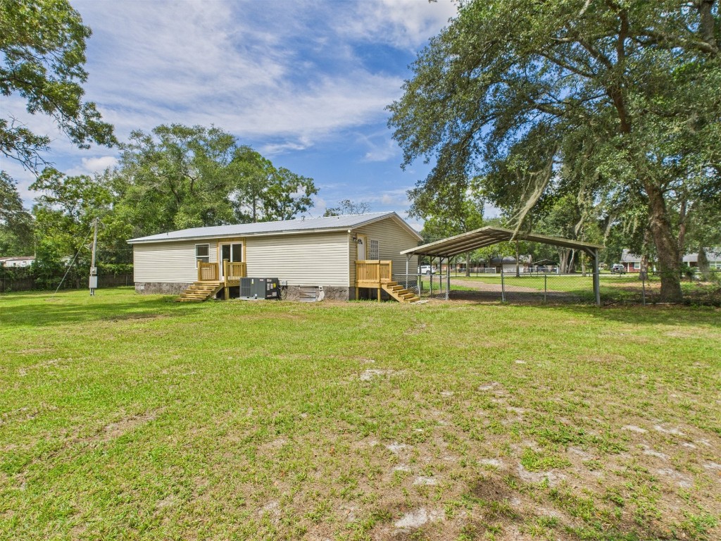 85490 Alene Road Yulee, FL 32097 - Photo 45 of 49 a front view of a house with a garden