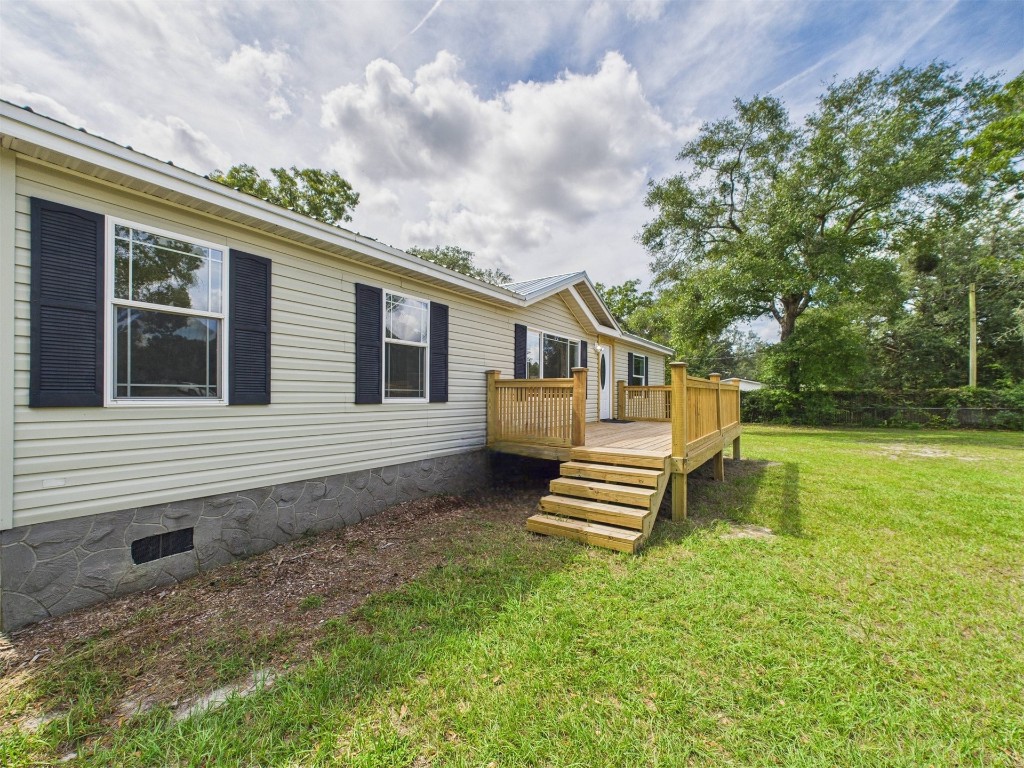 85490 Alene Road Yulee, FL 32097 - Photo 7 of 49 a front view of a house with a garden