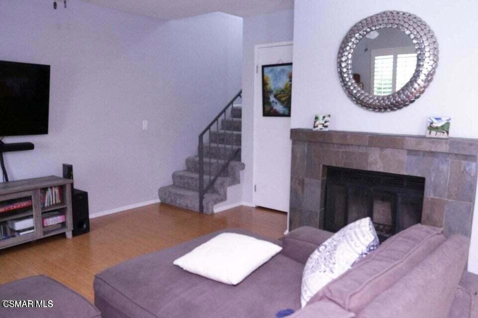 2388 Royal Avenue, Unit 26 Simi Valley, CA 93065 - Photo 7 of 11 a living room with furniture and a fireplace