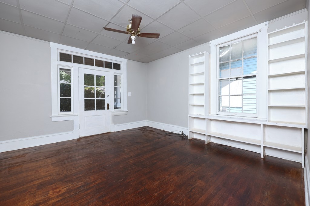 2904 Beacon Avenue Columbus, GA 31904 - Photo 11 of 39 a view of an empty room with a window and wooden floor