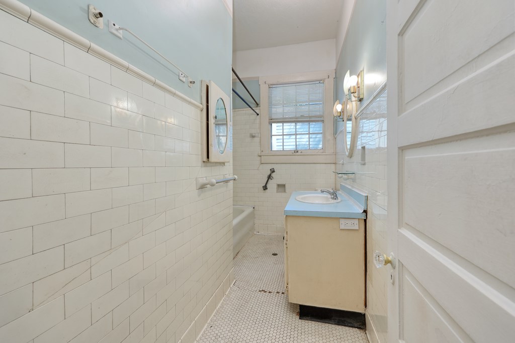 2904 Beacon Avenue Columbus, GA 31904 - Photo 15 of 39 a bathroom with a sink a toilet and mirror