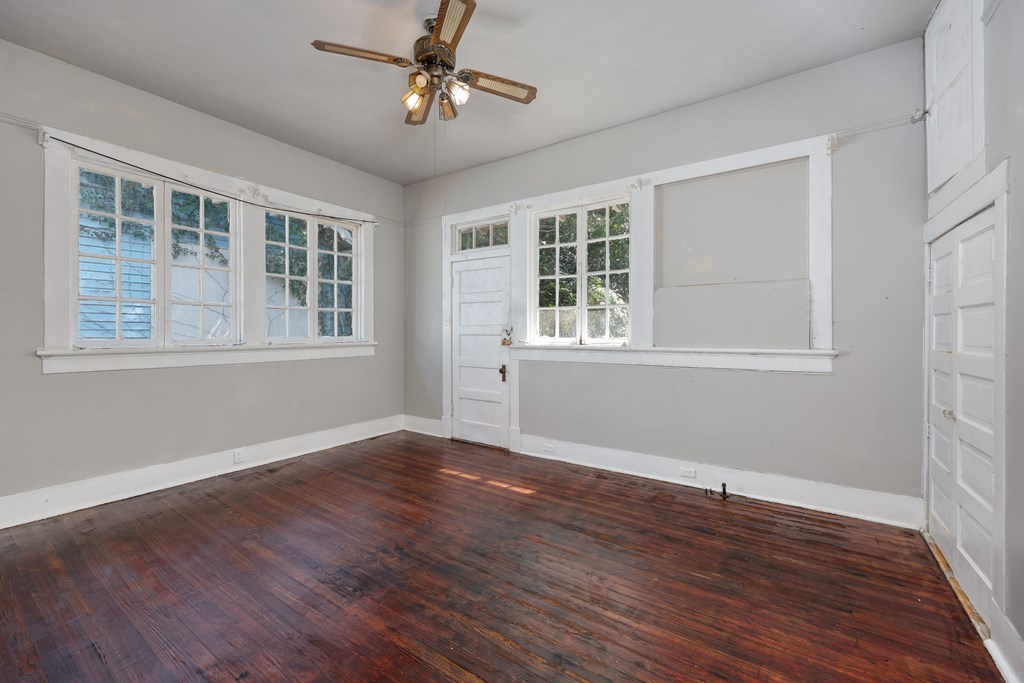 2904 Beacon Avenue Columbus, GA 31904 - Photo 17 of 39 a view of an empty room with wooden floor and windows