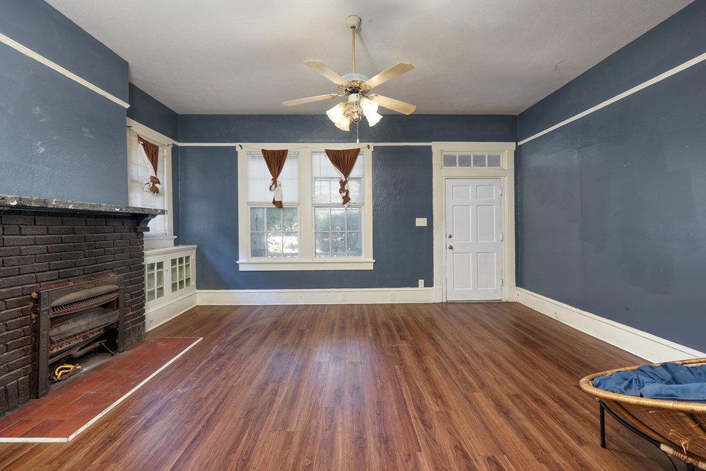 2904 Beacon Avenue Columbus, GA 31904 - Photo 22 of 39 a view of an empty room with wooden floor and a window