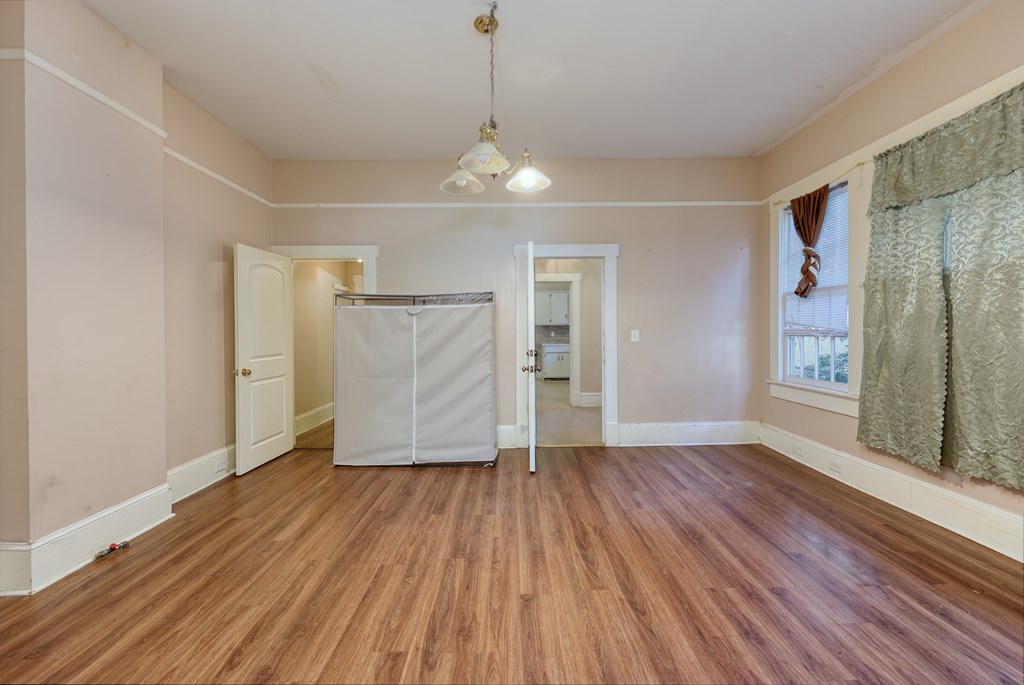 2904 Beacon Avenue Columbus, GA 31904 - Photo 23 of 39 wooden floor in an empty room with a window