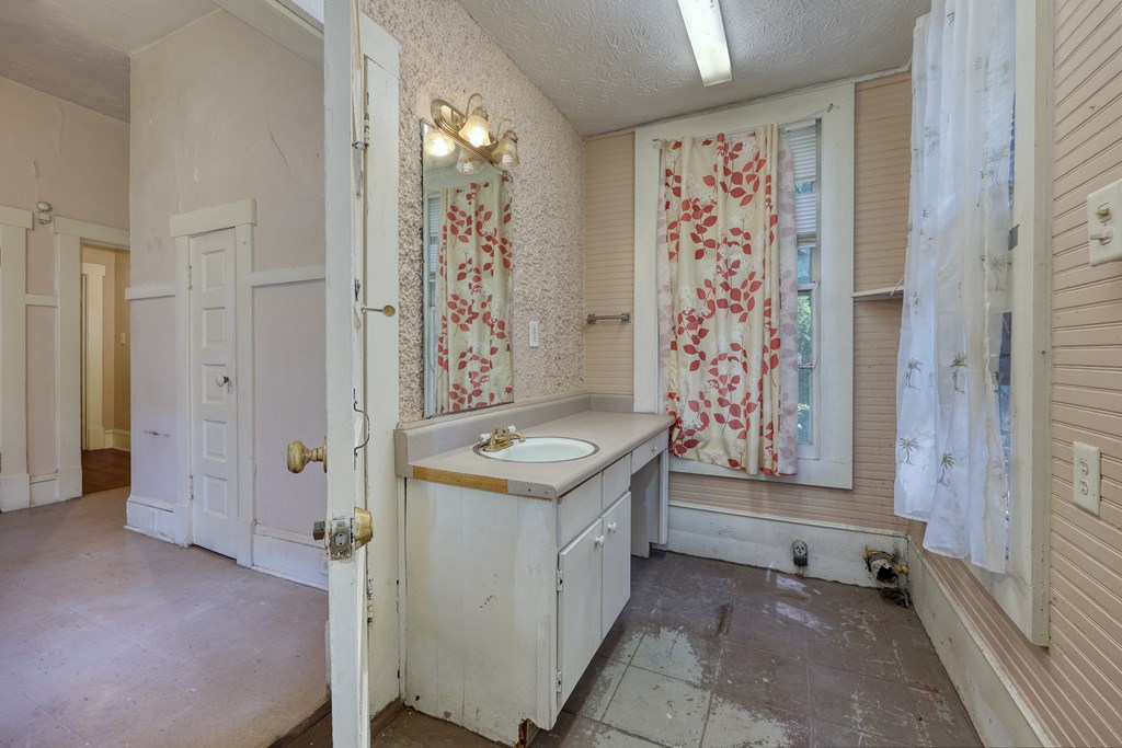 2904 Beacon Avenue Columbus, GA 31904 - Photo 31 of 39 a bathroom with a sink a toilet and shower