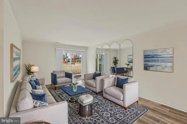 a living room with furniture chess board and a rug