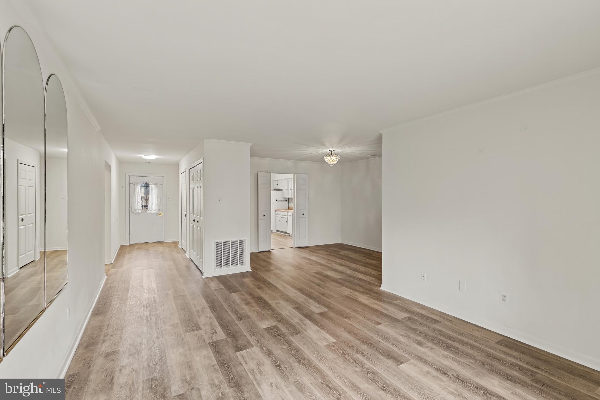 10 Kettle Court, Unit 76F Windsor Mill, MD 21244 - Photo 15 of 29 a view of a big room with wooden floor and windows