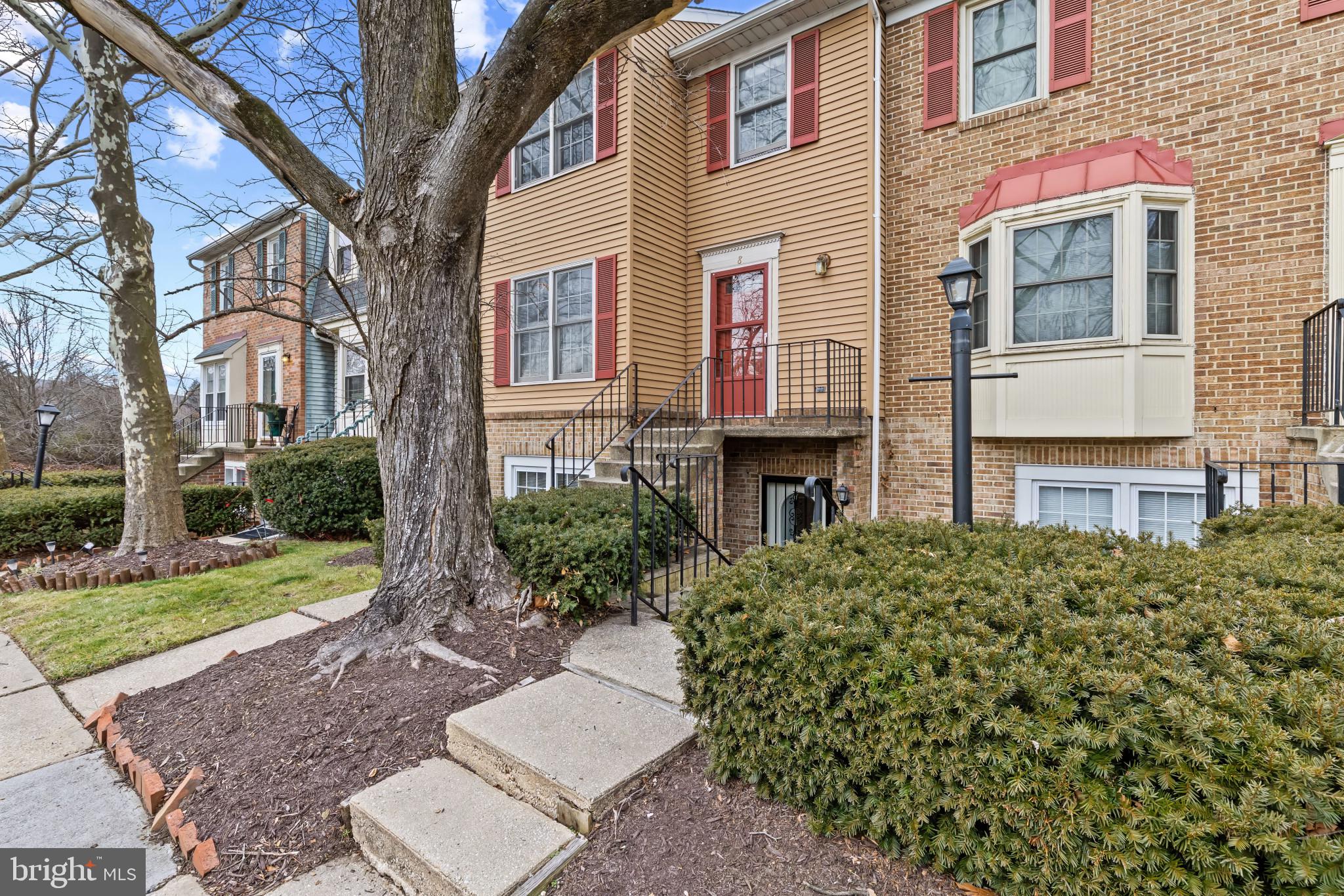 10 Kettle Court, Unit 76F Windsor Mill, MD 21244 - Photo 2 of 29 a front view of a house with garden