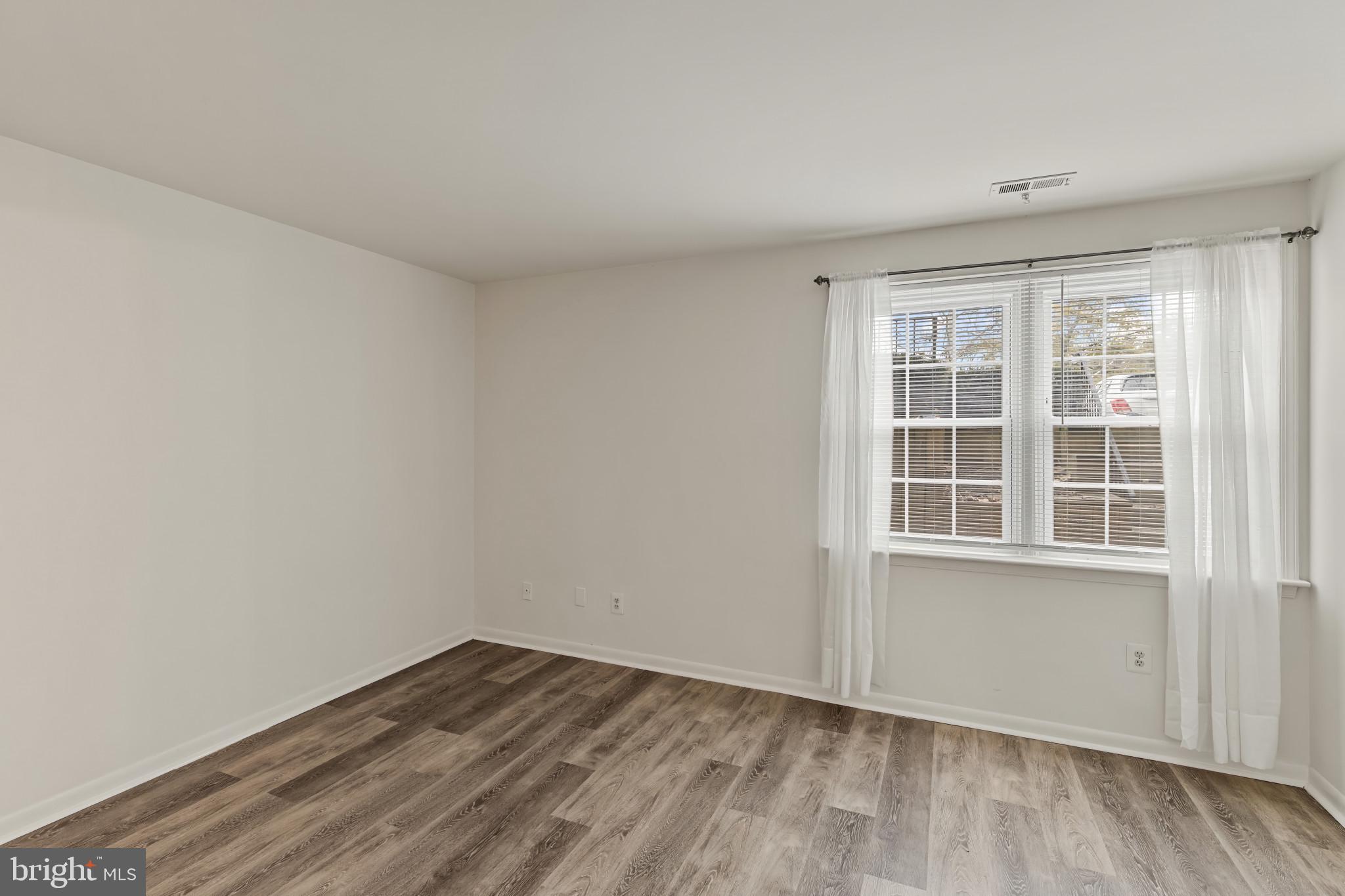 10 Kettle Court, Unit 76F Windsor Mill, MD 21244 - Photo 27 of 29 an empty room with a window