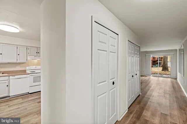 a view of a kitchen from the hallway