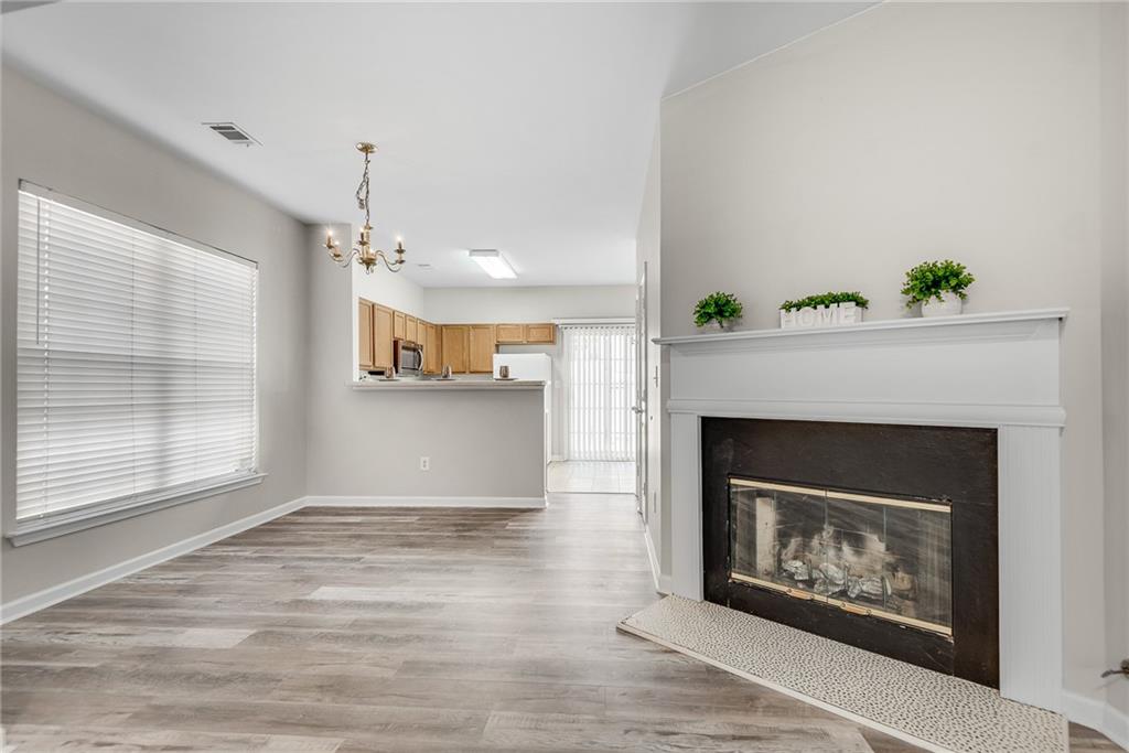 1534 Cove Creek Circle Norcross, GA 30093 - Photo 11 of 33 a view of a livingroom with a fireplace and window