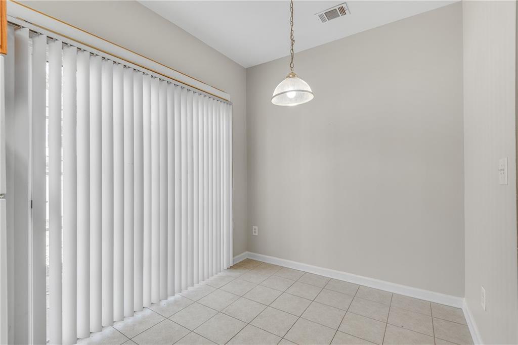 1534 Cove Creek Circle Norcross, GA 30093 - Photo 15 of 33 a view of an empty room with a window