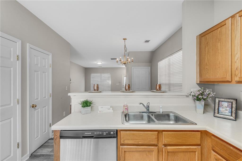 1534 Cove Creek Circle Norcross, GA 30093 - Photo 16 of 33 a bathroom with sink a faucet a mirror and vanity