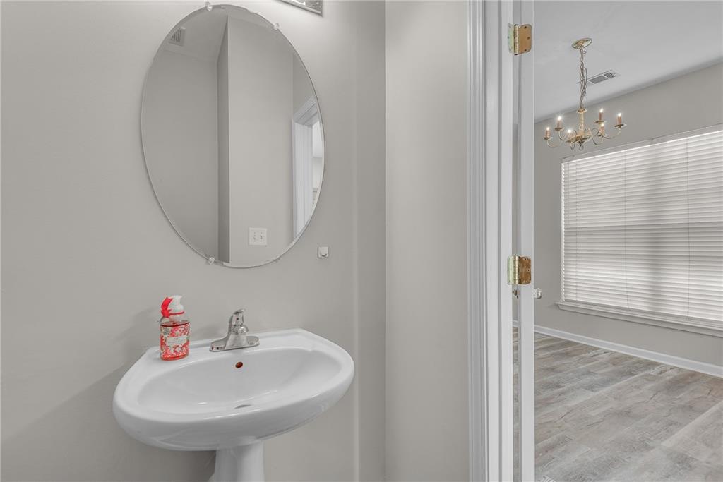 1534 Cove Creek Circle Norcross, GA 30093 - Photo 18 of 33 a bathroom with a sink and a mirror