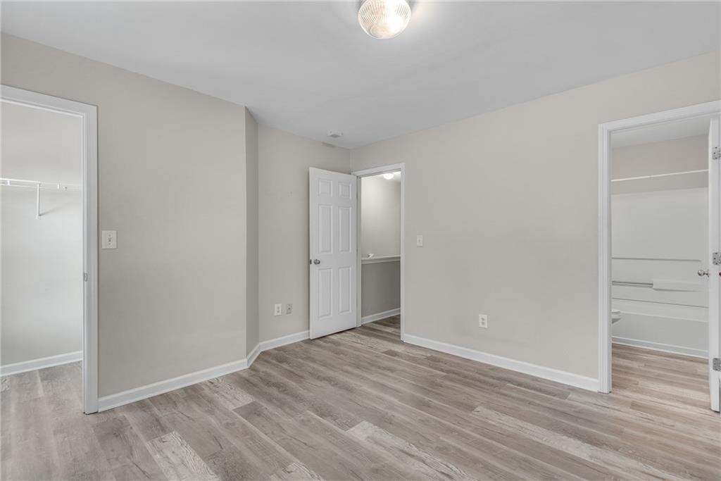 1534 Cove Creek Circle Norcross, GA 30093 - Photo 25 of 33 a view of an empty room with wooden floor