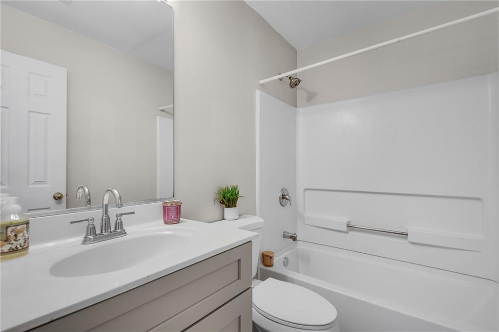 1534 Cove Creek Circle Norcross, GA 30093 - Photo 26 of 33 a bathroom with a sink toilet and shower