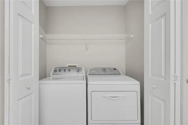 a view of a front door and a yard