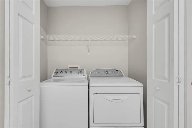 a view of a front door and a yard