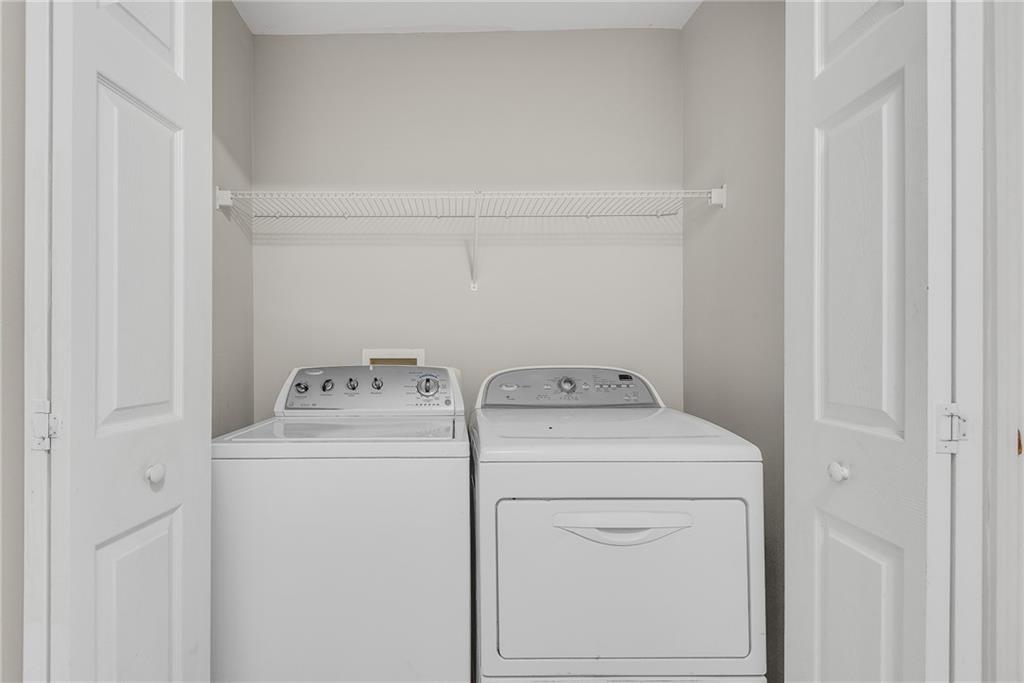1534 Cove Creek Circle Norcross, GA 30093 - Photo 27 of 33 a utility room with dryer and washer