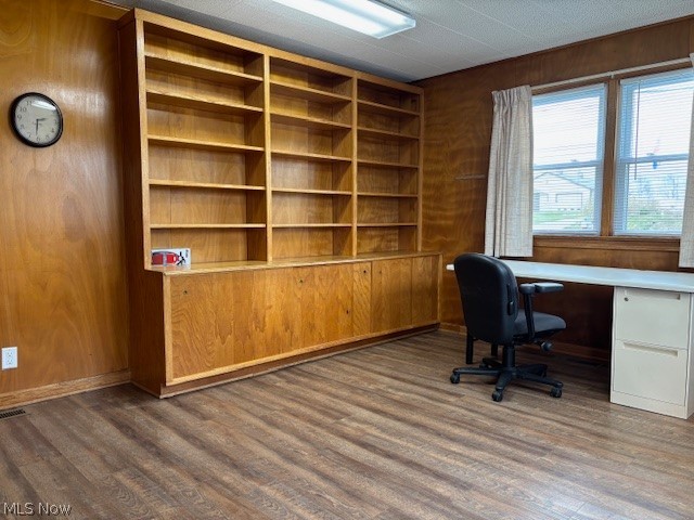 11146 Cadiz Road Cambridge, OH 43725 - Photo 3 of 28 Office area featuring built in shelves, dark wood-style floors, and wood walls