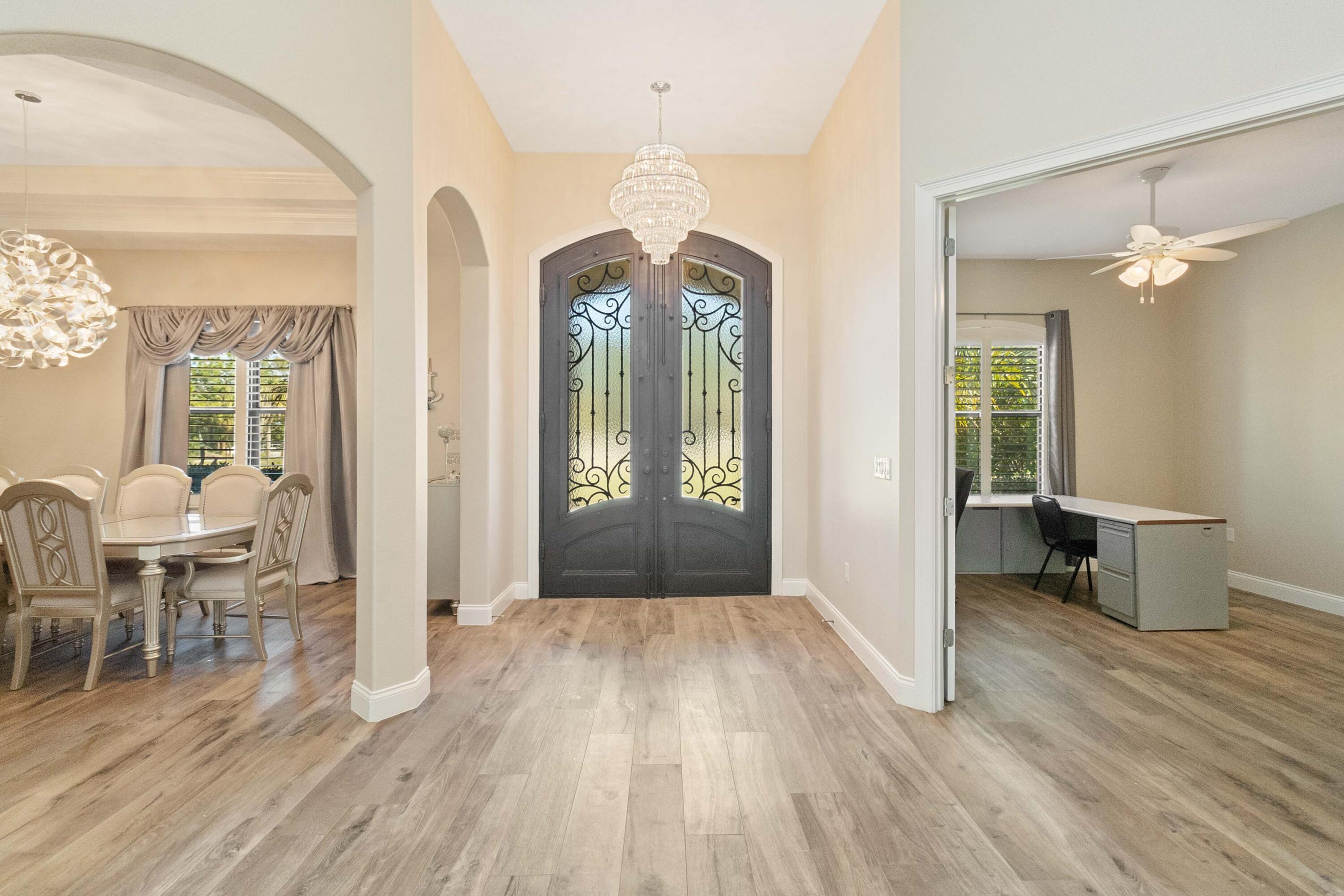 3640 Corey Road Grant Valkaria, FL 32950 - Photo 12 of 77 wooden floor in an empty room with a window