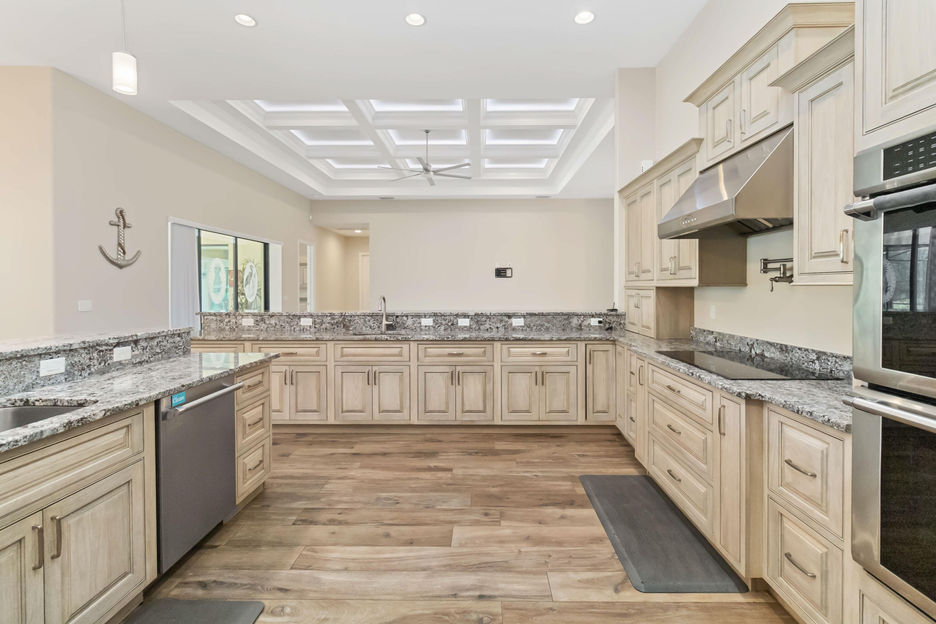 3640 Corey Road Grant Valkaria, FL 32950 - Photo 19 of 77 a large white kitchen with granite countertop a stove and a sink