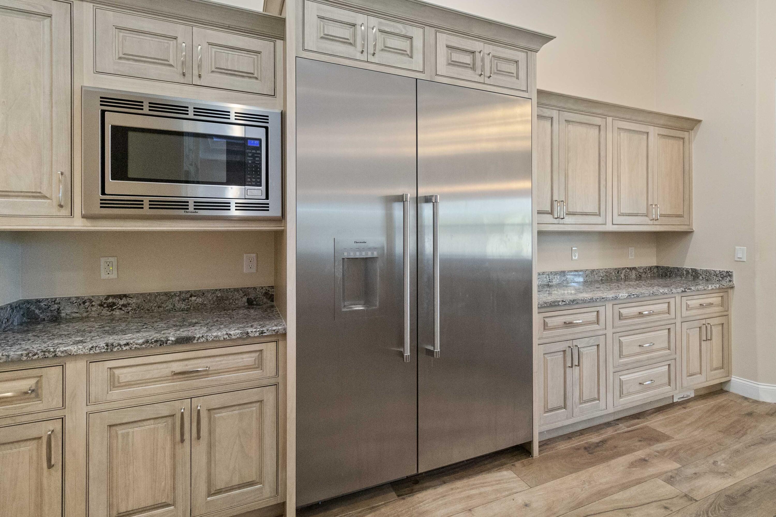 3640 Corey Road Grant Valkaria, FL 32950 - Photo 20 of 77 a kitchen with cabinets stainless steel appliances and a counter space