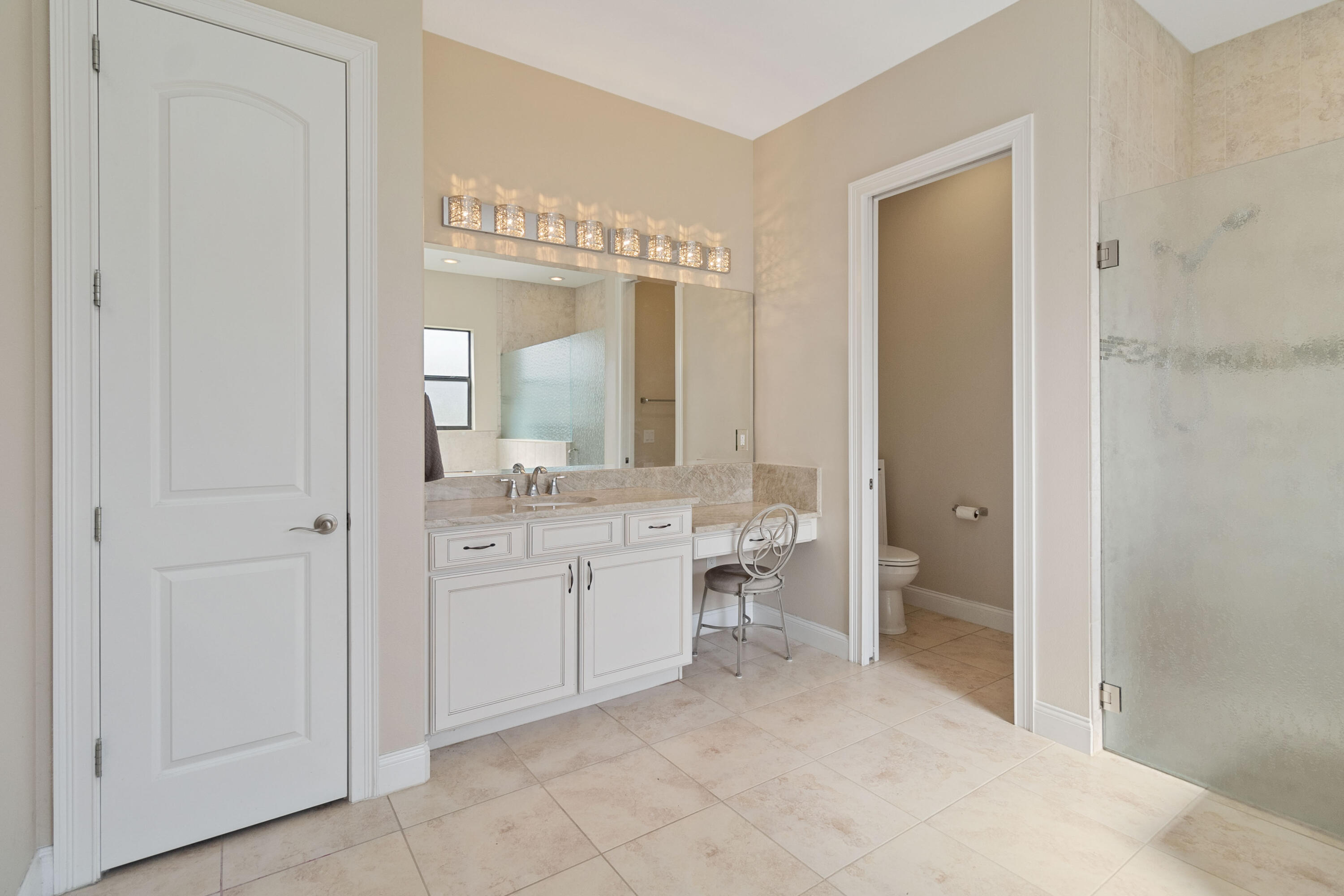 3640 Corey Road Grant Valkaria, FL 32950 - Photo 29 of 77 a spacious bathroom with a double vanity sink a mirror and a bathtub