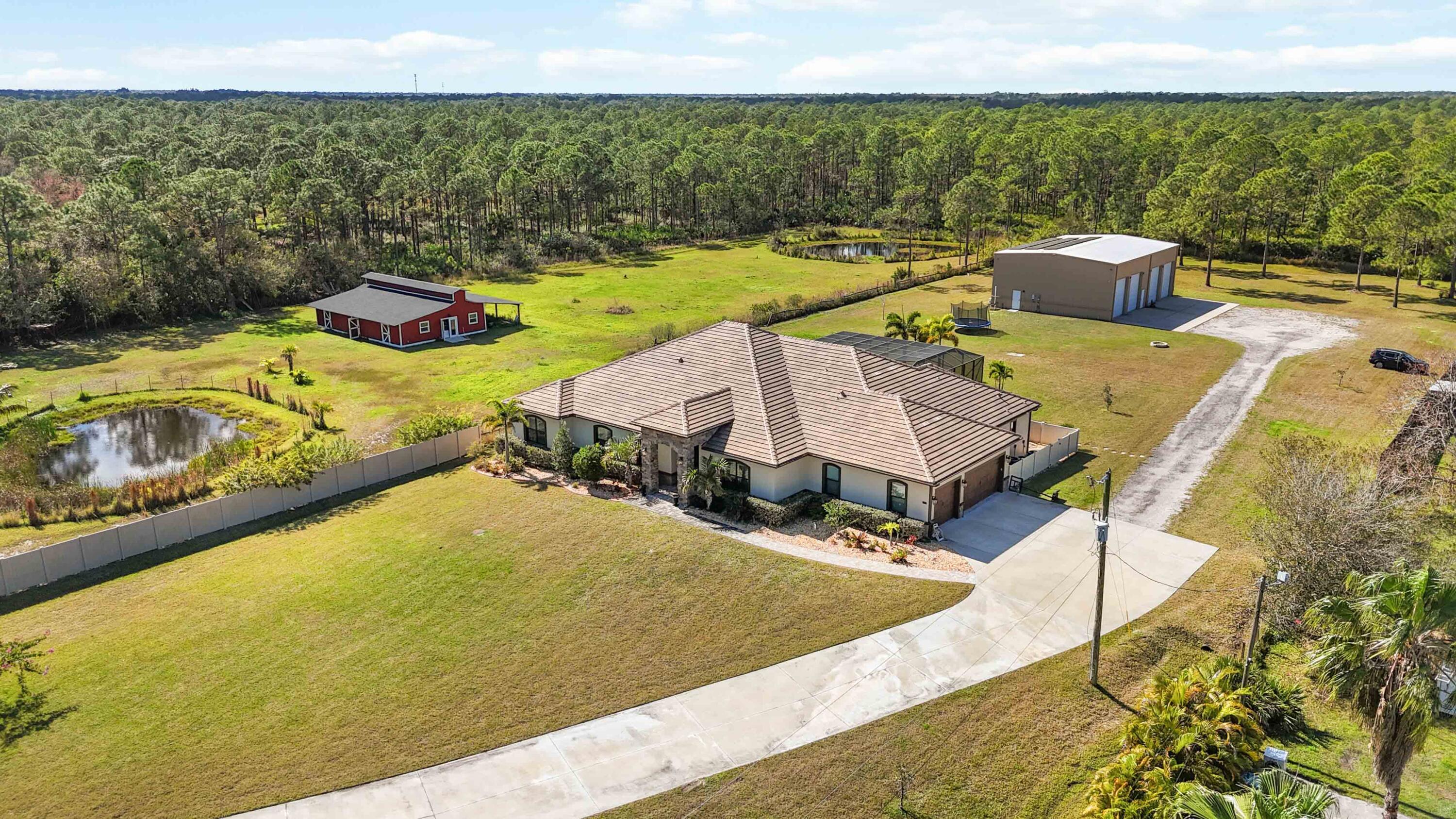 3640 Corey Road Grant Valkaria, FL 32950 - Photo 3 of 77 a view of a swimming pool and an outdoor seating