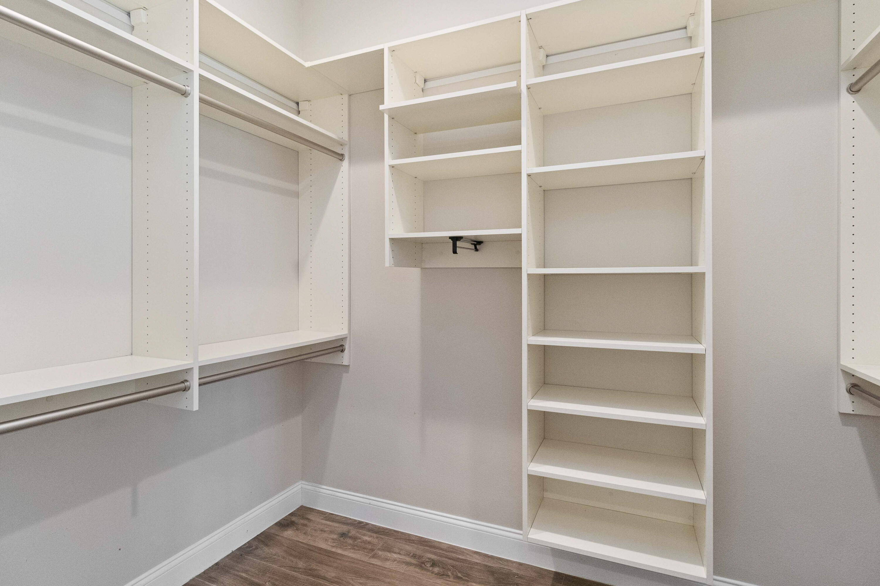 3640 Corey Road Grant Valkaria, FL 32950 - Photo 33 of 77 a view of walk in closet with empty racks