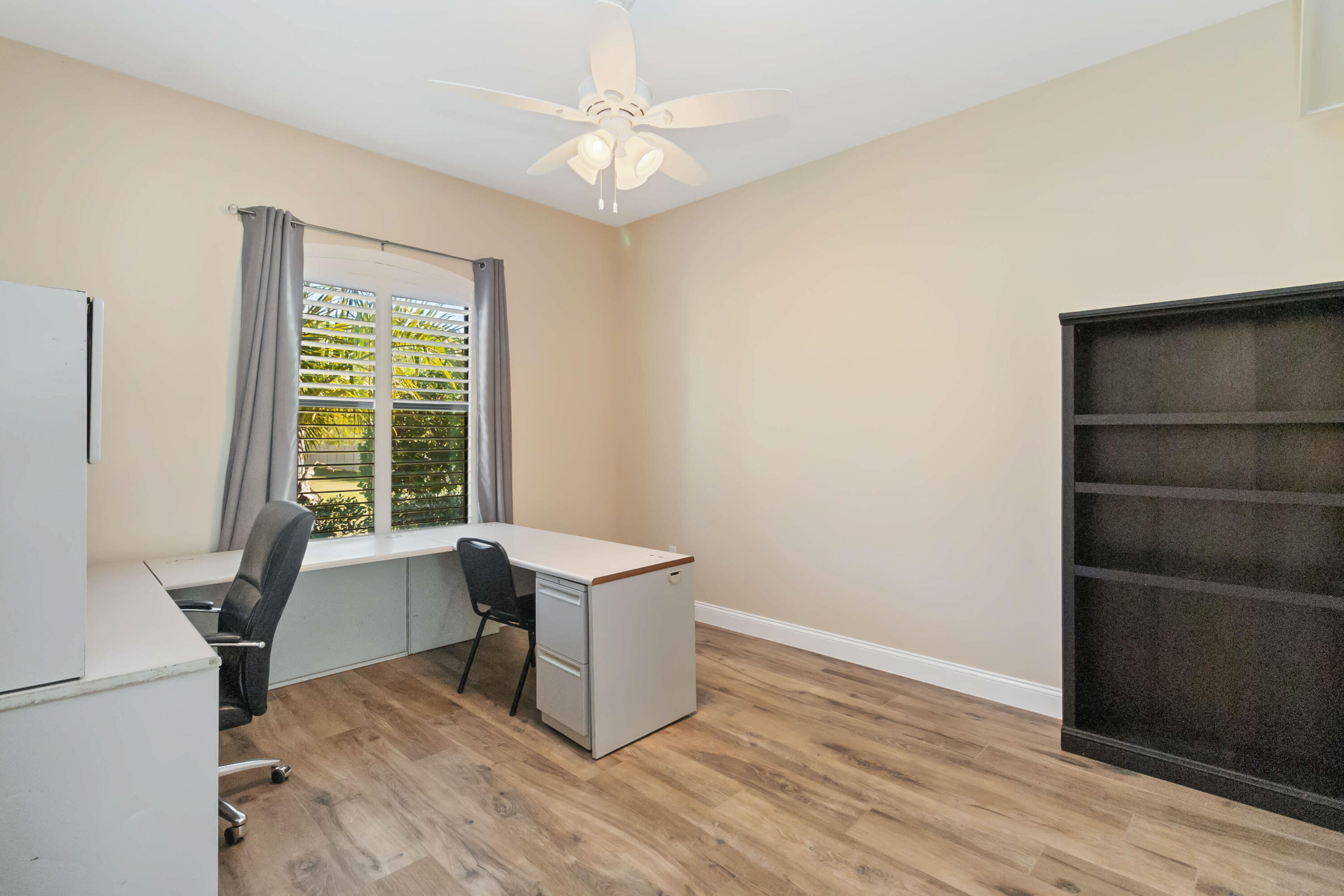 3640 Corey Road Grant Valkaria, FL 32950 - Photo 34 of 77 a workspace with wooden floor and windows