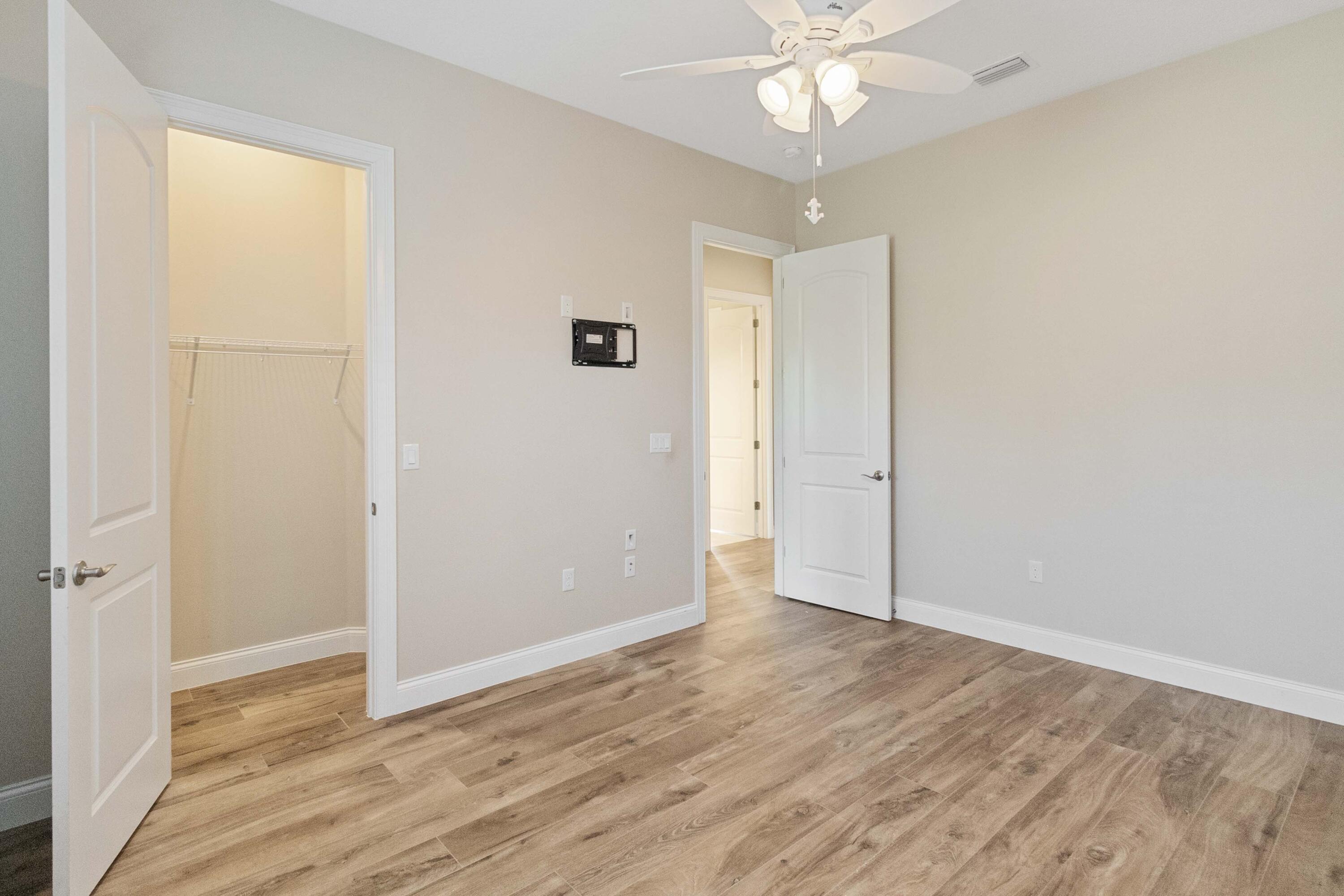 3640 Corey Road Grant Valkaria, FL 32950 - Photo 43 of 77 wooden floor in an empty room with a window